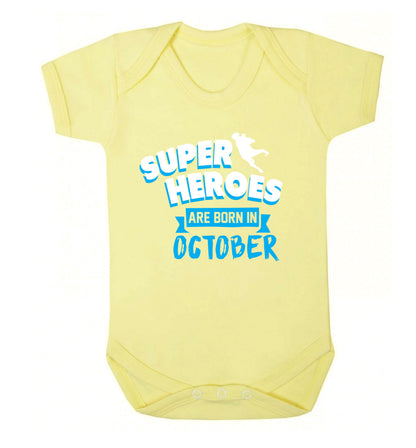 Superheroes are born in October Baby Vest pale yellow 18-24 months