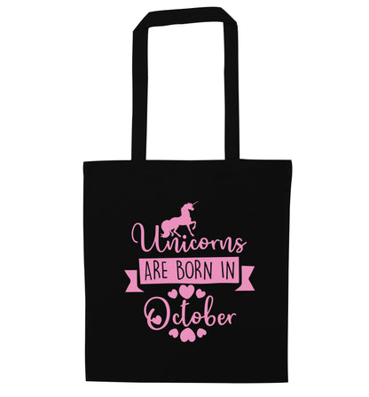 Unicorns are born in October black tote bag