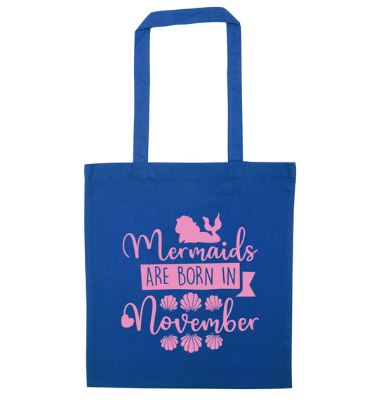Mermaids are born in November blue tote bag
