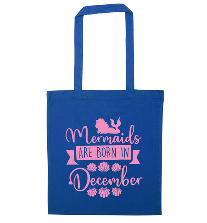 Mermaids are born in December blue tote bag