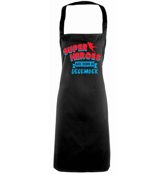 Superheroes are born in December black apron