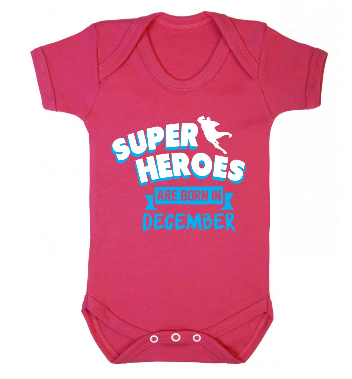 Superheroes are born in December Baby Vest dark pink 18-24 months