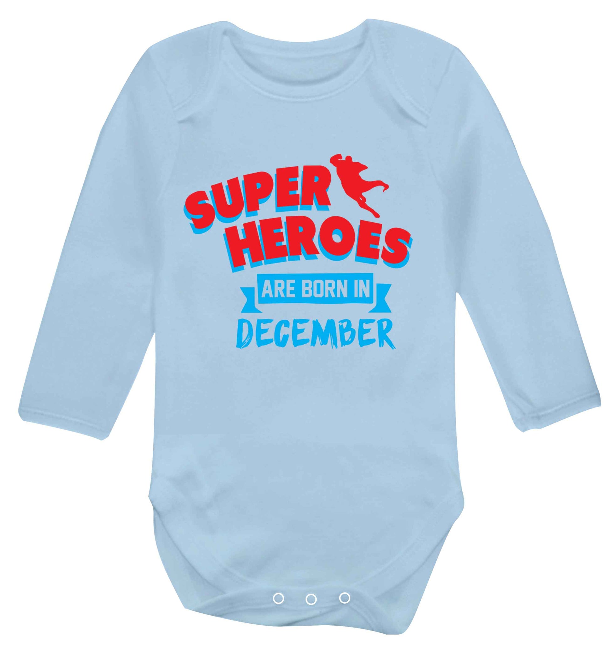 Superheroes are born in December Baby Vest long sleeved pale blue 6-12 months