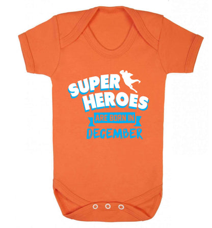 Superheroes are born in December Baby Vest orange 18-24 months