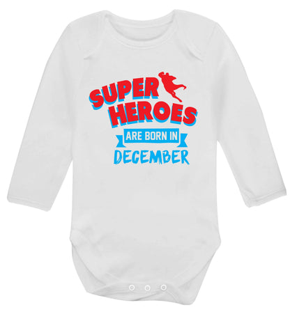 Superheroes are born in December Baby Vest long sleeved white 6-12 months