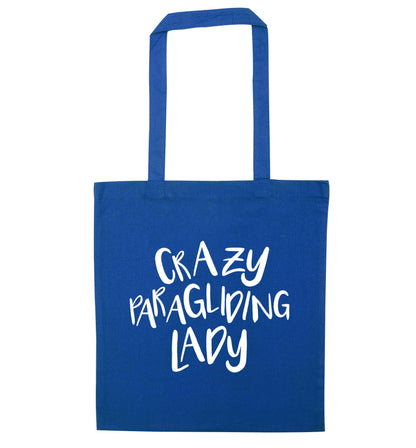 Crazy paragliding lady blue tote bag