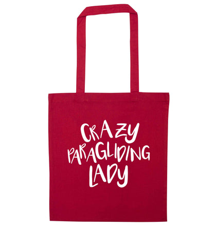Crazy paragliding lady red tote bag