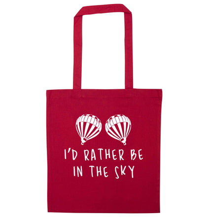 My head is in the clouds red tote bag
