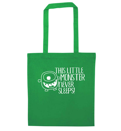 This little monster never sleeps green tote bag