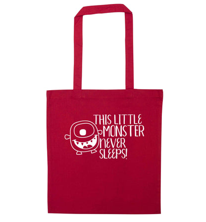 This little monster never sleeps red tote bag
