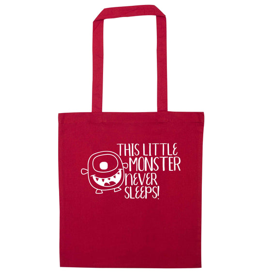 This little monster never sleeps red tote bag