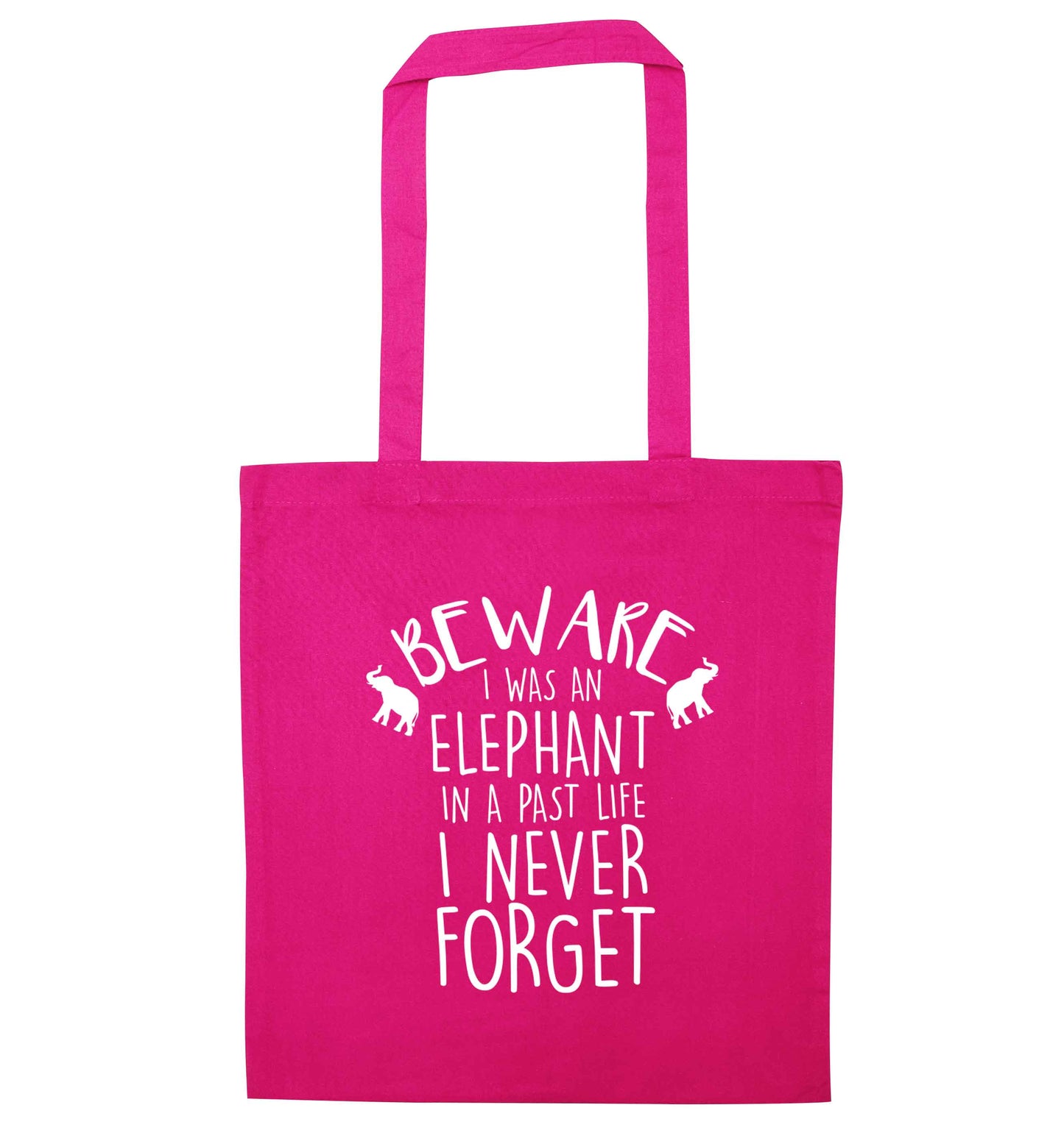 Beware I was an elephant in my past life I never forget pink tote bag