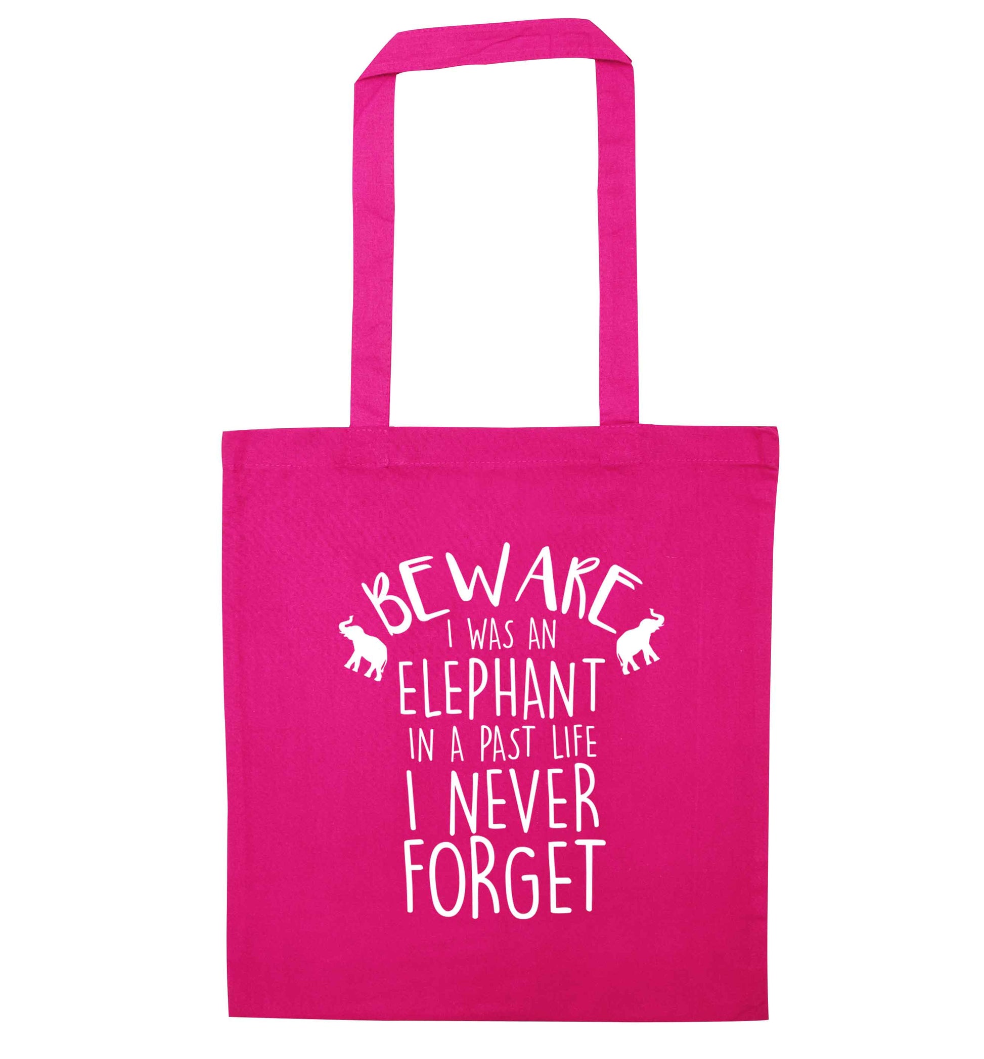 Beware I was an elephant in my past life I never forget pink tote bag