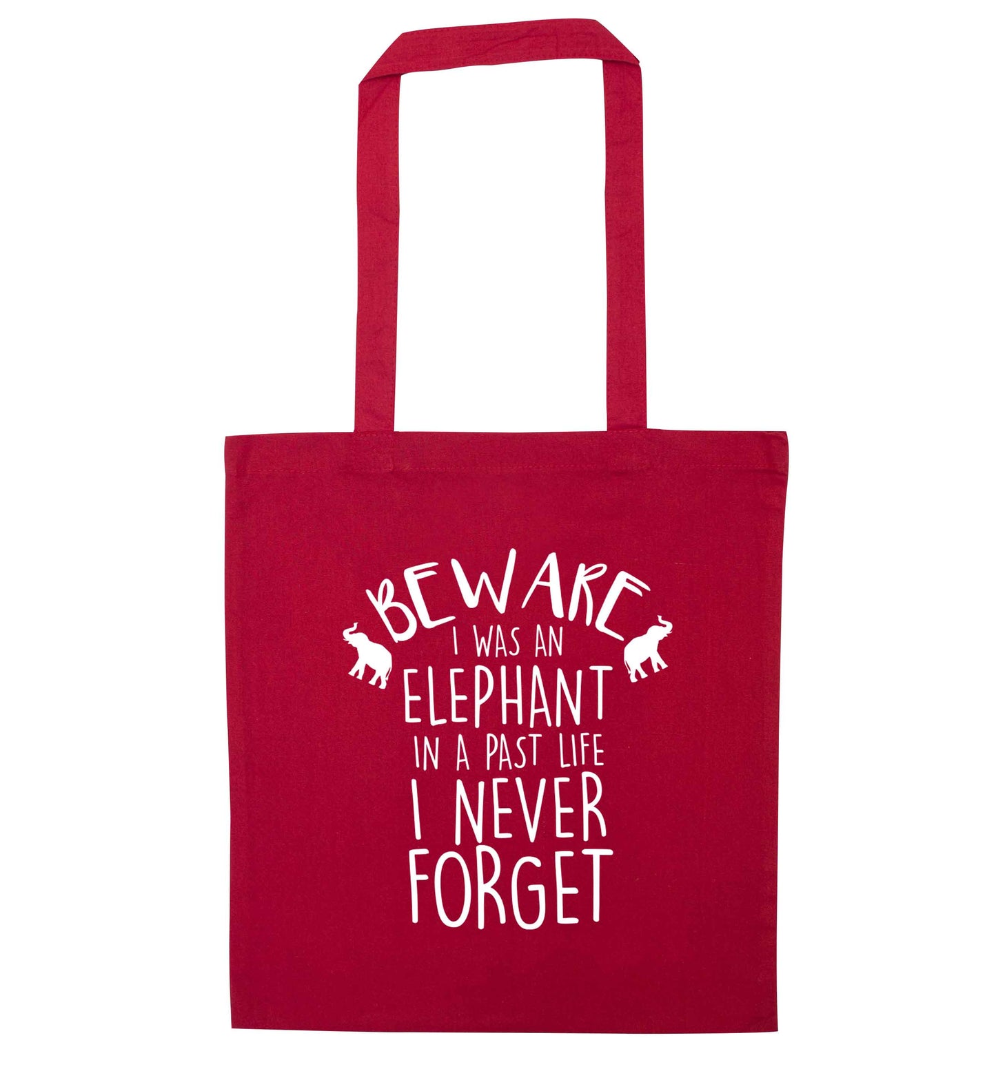 Beware I was an elephant in my past life I never forget red tote bag