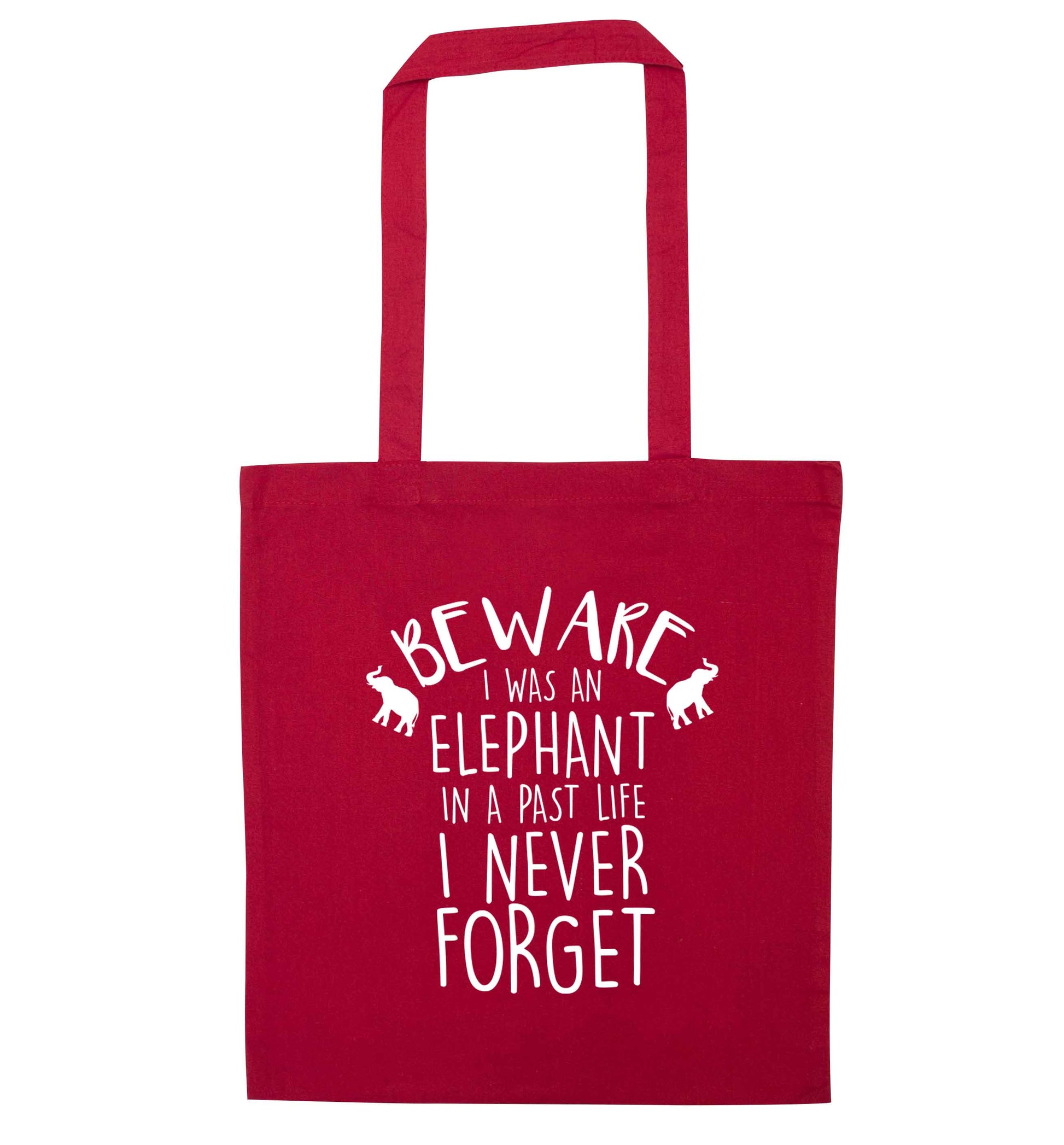 Beware I was an elephant in my past life I never forget red tote bag