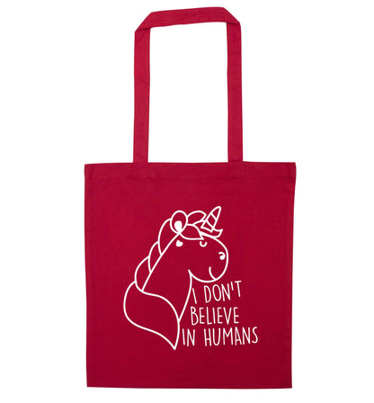 I don't believe in humans red tote bag