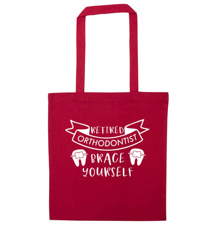 Retired orthodontist brace yourself red tote bag