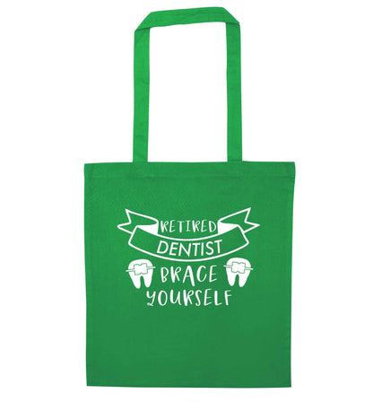Retired dentist brace yourself green tote bag