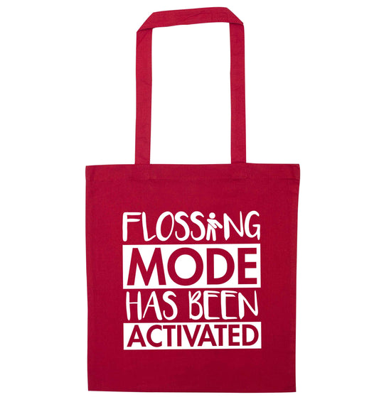 Flossing mode has been activated red tote bag