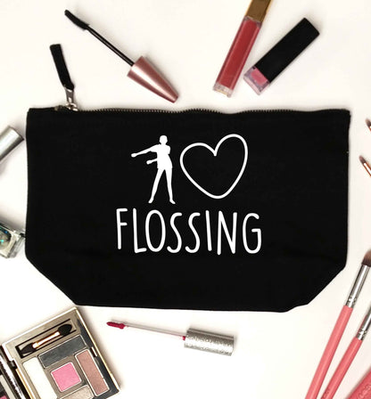 I love flossing black makeup bag