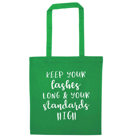 Keep your lashes long and your standards high green tote bag