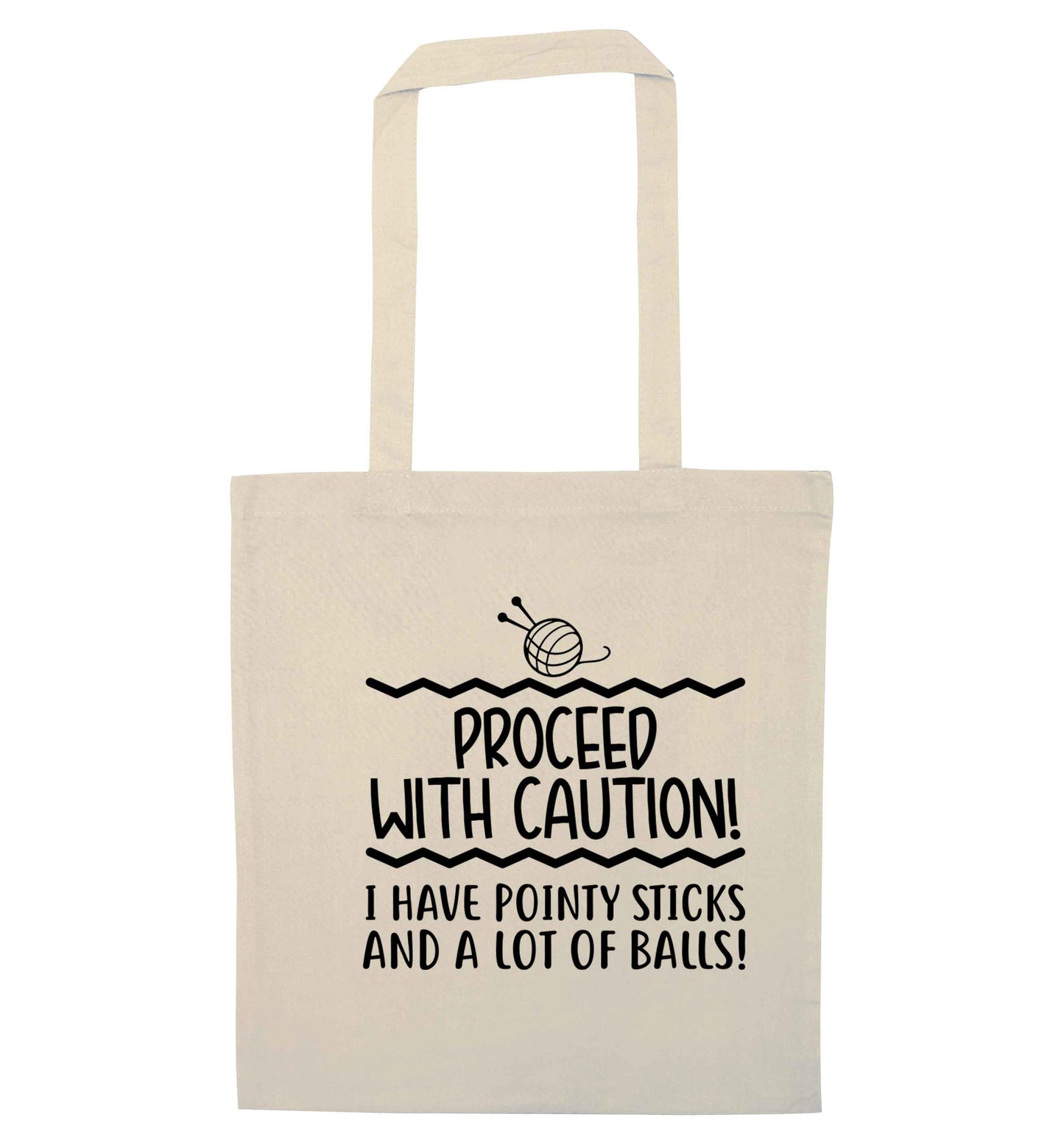Proceed with caution, I have pointy sticks and a lot of balls natural tote bag