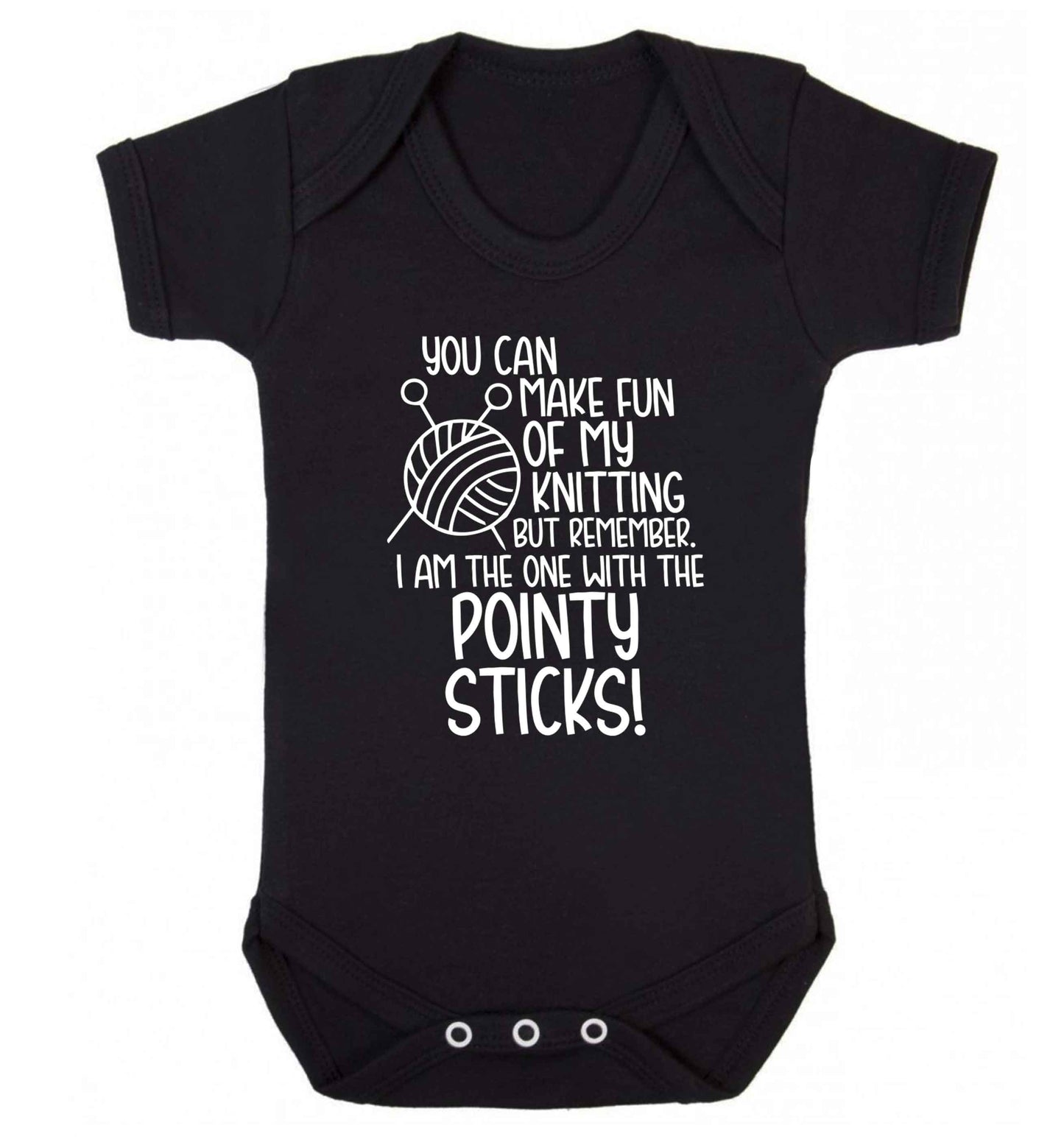 You can make fun of my knitting but remember. I'm the one with the pointy sticks! Baby Vest black 18-24 months