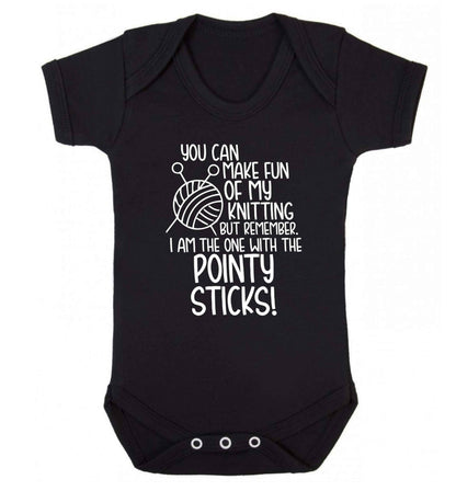 You can make fun of my knitting but remember. I'm the one with the pointy sticks! Baby Vest black 18-24 months