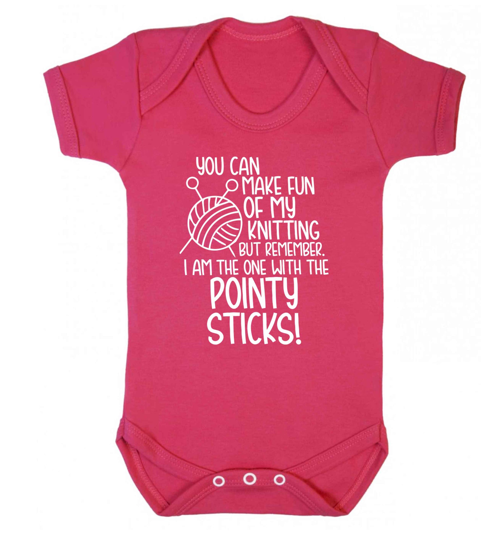 You can make fun of my knitting but remember. I'm the one with the pointy sticks! Baby Vest dark pink 18-24 months