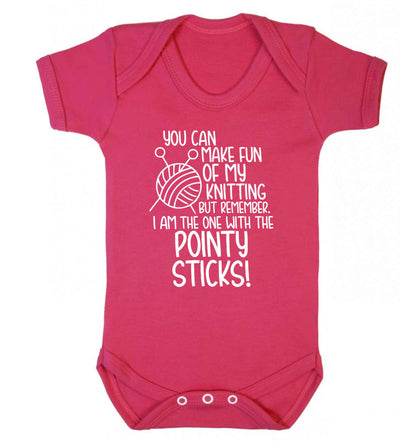 You can make fun of my knitting but remember. I'm the one with the pointy sticks! Baby Vest dark pink 18-24 months