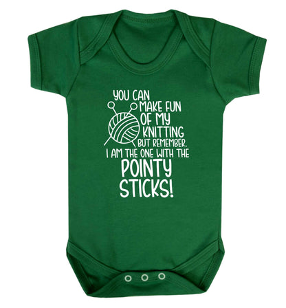 You can make fun of my knitting but remember. I'm the one with the pointy sticks! Baby Vest green 18-24 months
