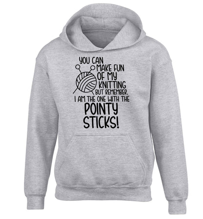 You can make fun of my knitting but remember. I'm the one with the pointy sticks! children's grey hoodie 12-13 Years
