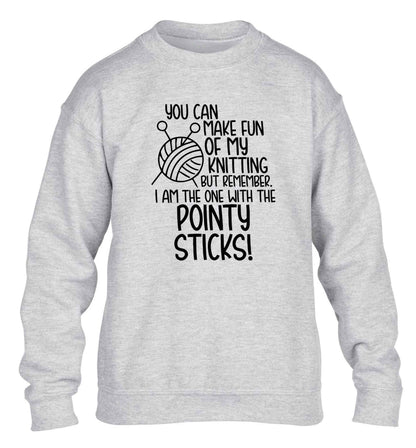 You can make fun of my knitting but remember. I'm the one with the pointy sticks! children's grey sweater 12-13 Years
