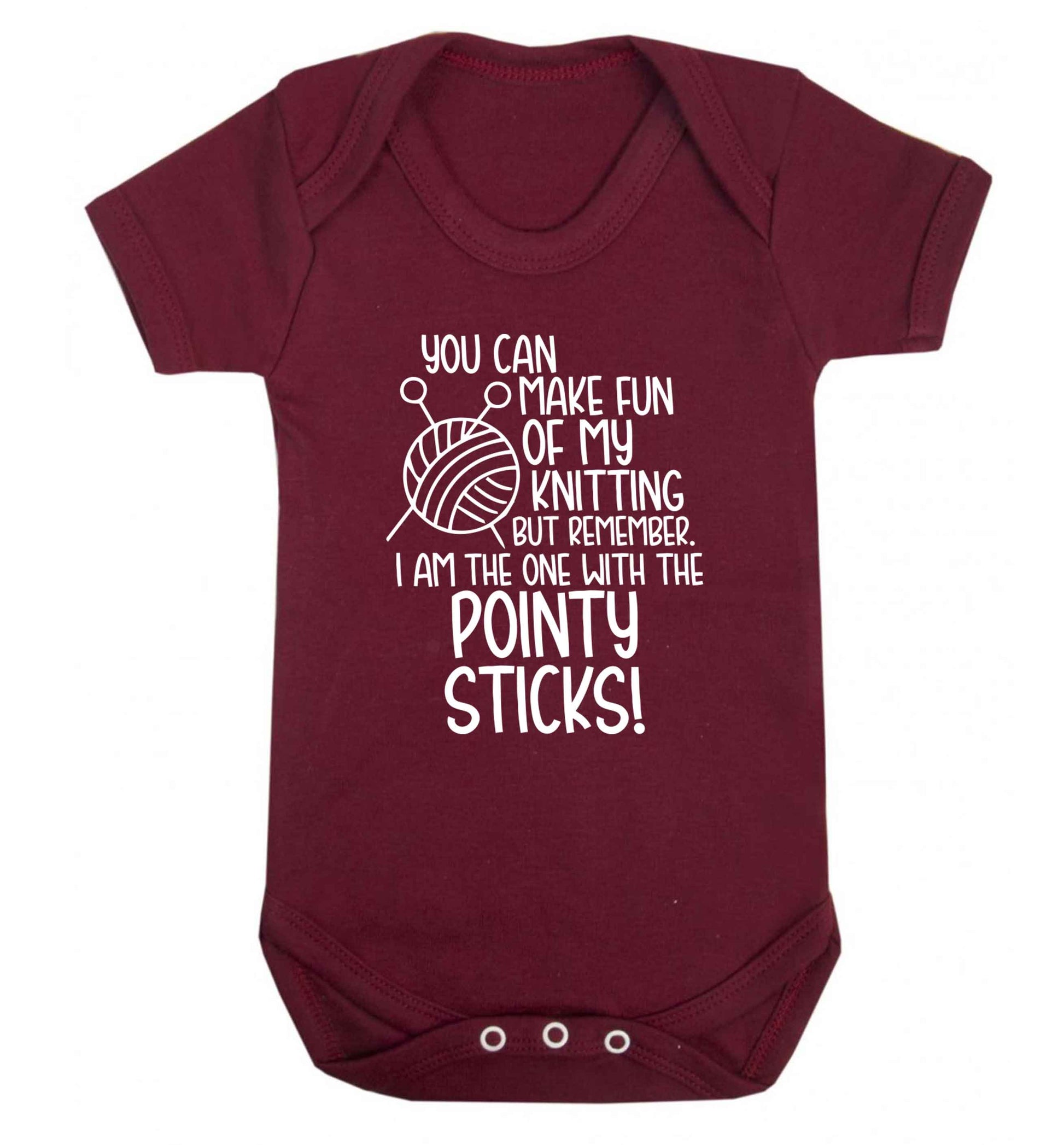 You can make fun of my knitting but remember. I'm the one with the pointy sticks! Baby Vest maroon 18-24 months