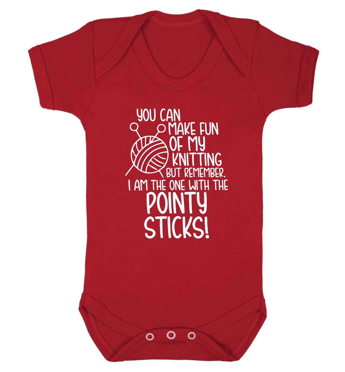 You can make fun of my knitting but remember. I'm the one with the pointy sticks! Baby Vest red 18-24 months