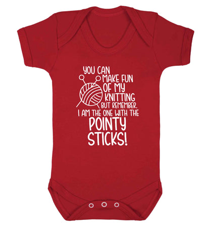 You can make fun of my knitting but remember. I'm the one with the pointy sticks! Baby Vest red 18-24 months
