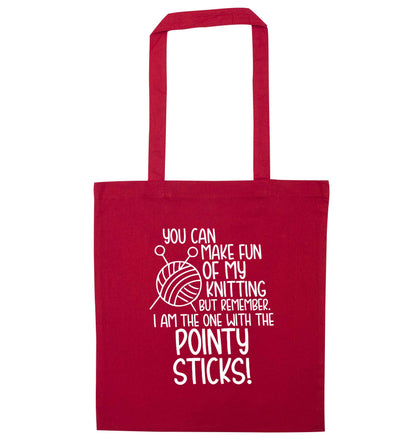 You can make fun of my knitting but remember. I'm the one with the pointy sticks! red tote bag