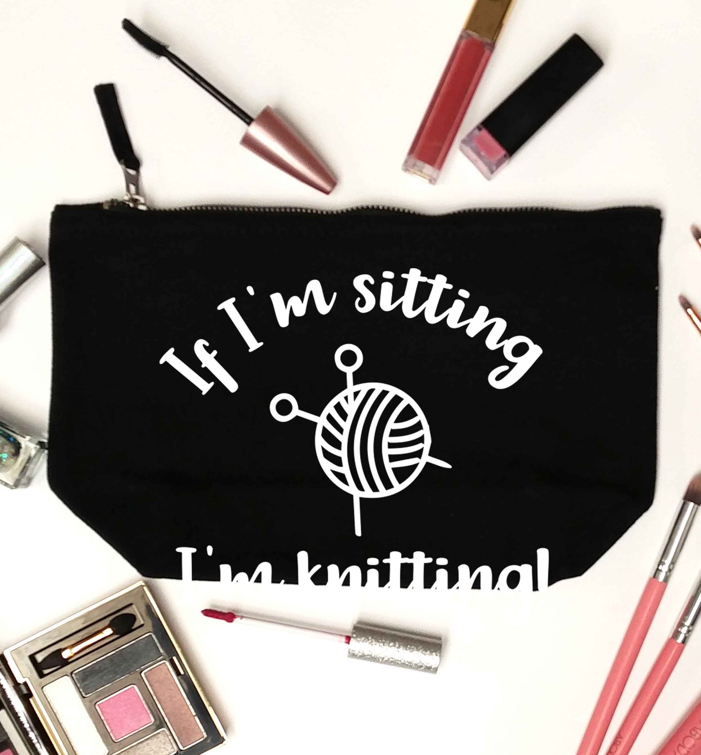 If I'm sitting I'm knitting black makeup bag
