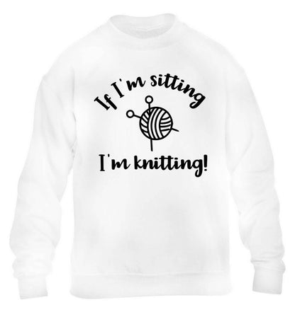 If I'm sitting I'm knitting children's white sweater 12-13 Years