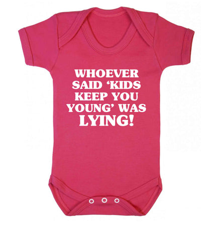 Whoever said 'kids keep you young' was lying! Baby Vest dark pink 18-24 months