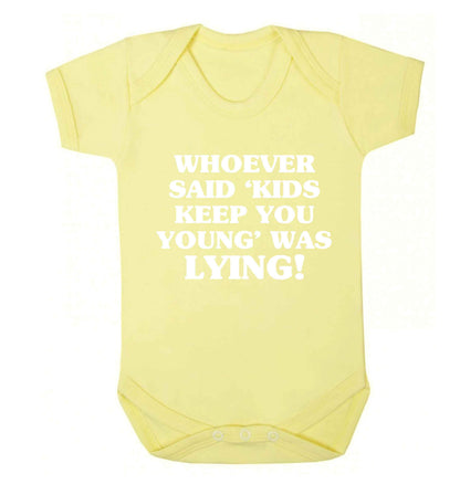 Whoever said 'kids keep you young' was lying! Baby Vest pale yellow 18-24 months