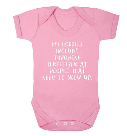 Throwing fertilizer at people that need to grow up Baby Vest pale pink 18-24 months