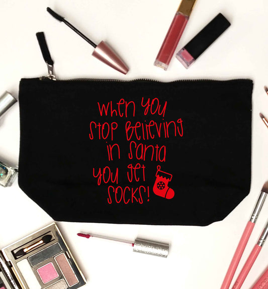 When you stop believing in santa you get socks black makeup bag