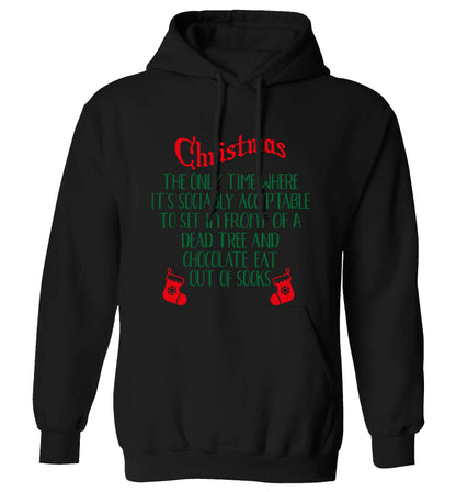 Christmas sit in front of a dead tree and eat chocolate out of socks adults unisex black hoodie 2XL