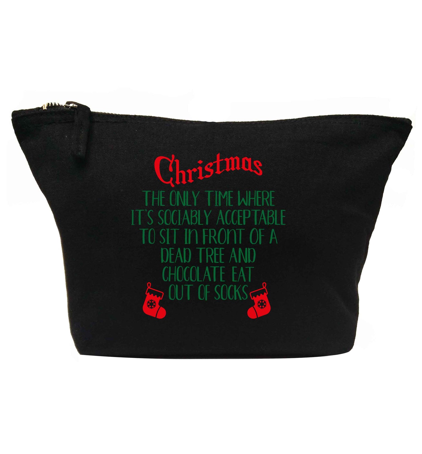 Christmas sit in front of a dead tree and eat chocolate out of socks | makeup / wash bag