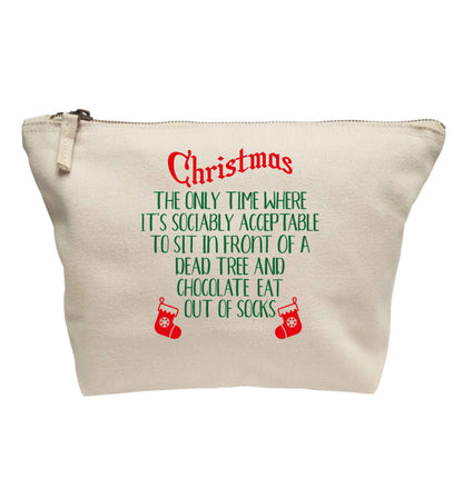 Christmas sit in front of a dead tree and eat chocolate out of socks | makeup / wash bag