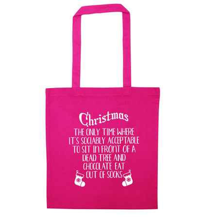 Christmas sit in front of a dead tree and eat chocolate out of socks pink tote bag