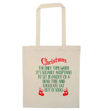 Christmas sit in front of a dead tree and eat chocolate out of socks natural tote bag