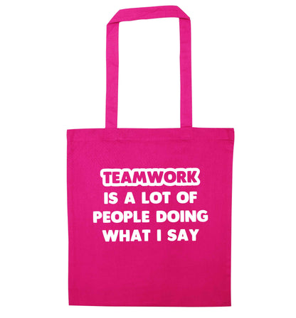 Teamwork is a lot of people doing what I say pink tote bag