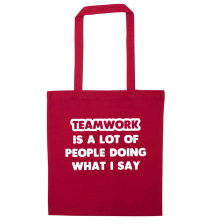Teamwork is a lot of people doing what I say red tote bag